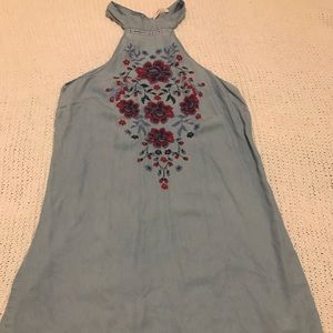 Denim dress with floral embroidery.